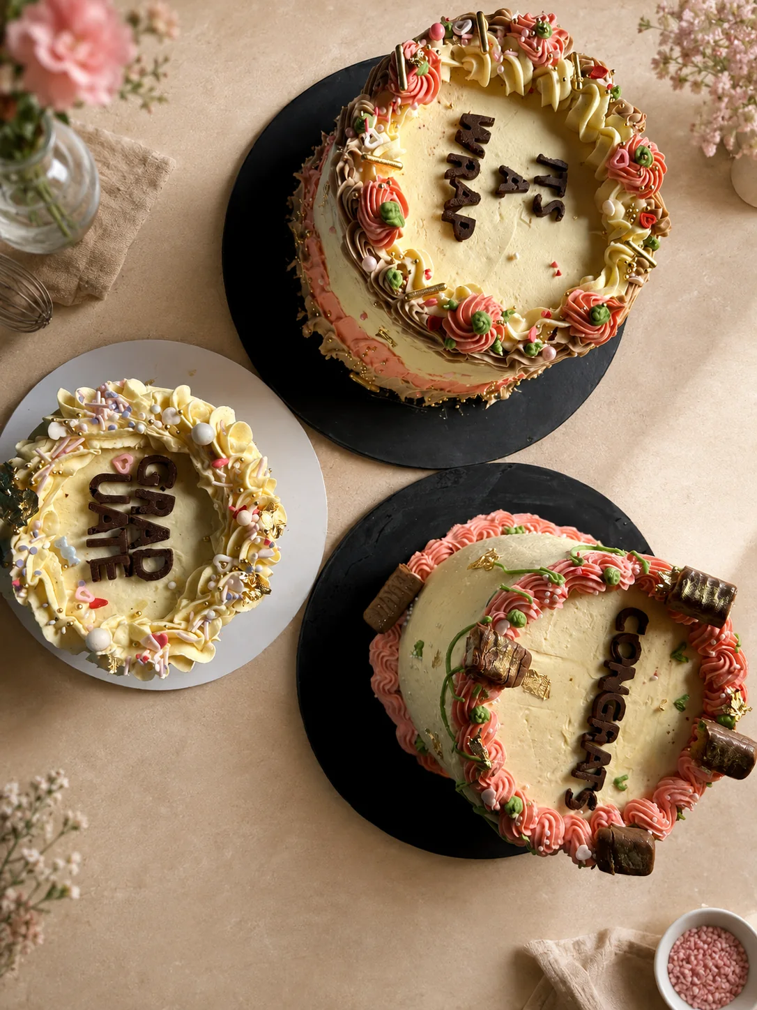 Styled celebration cake concept featuring three decorated cakes